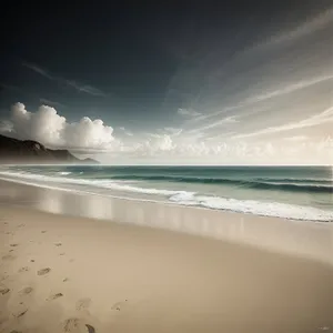 Golden Shoreline: Serene Beach Landscape with Clear Blue Waters