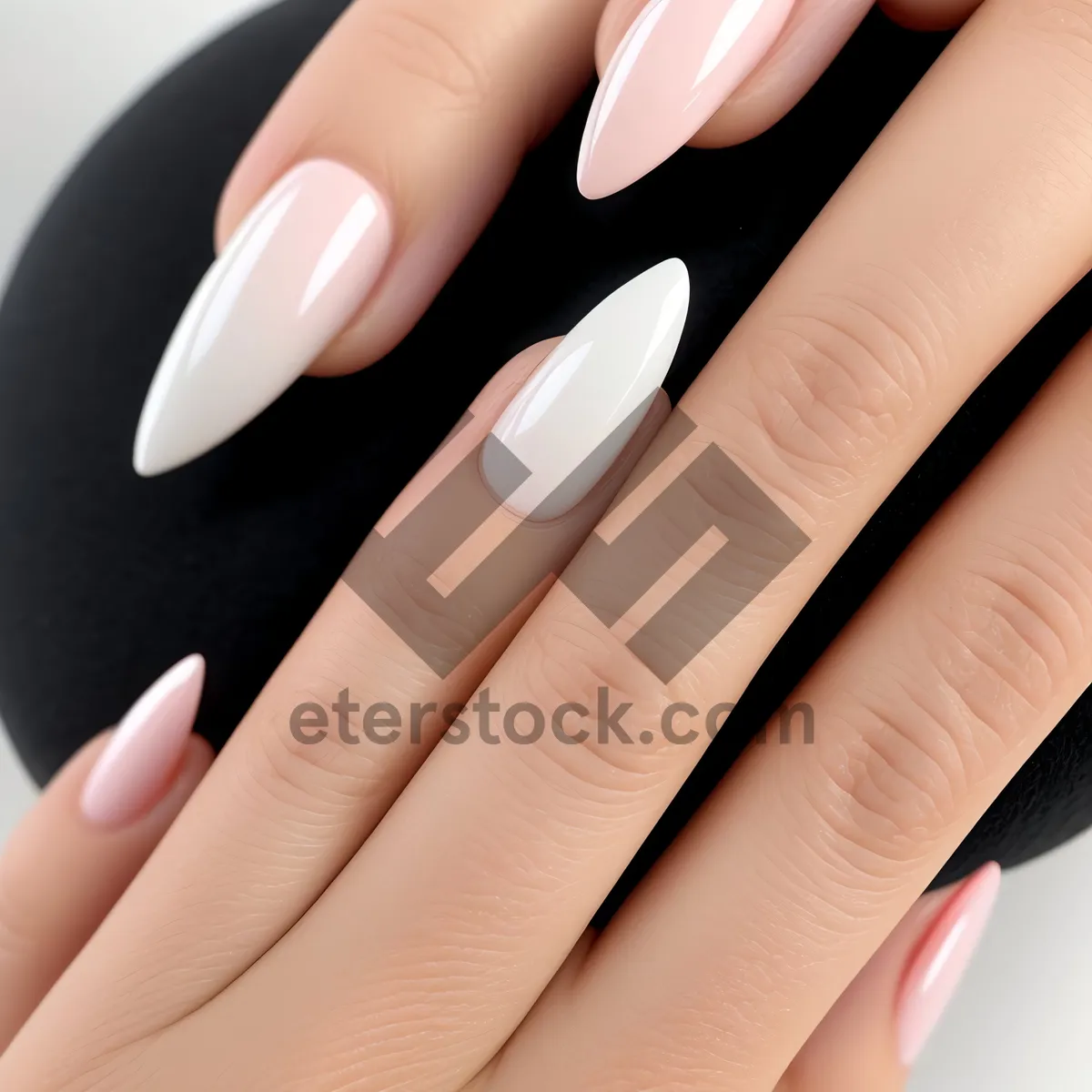 Picture of Manicured hands showcasing elegant nail art.