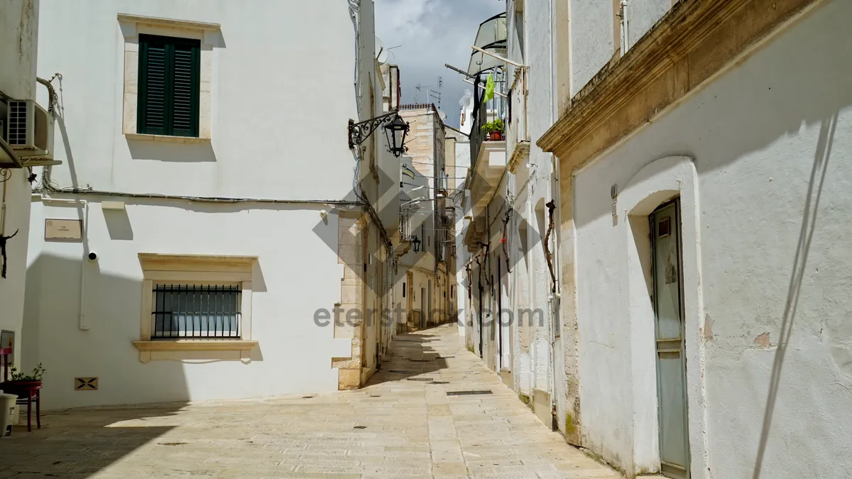 Picture of Old stone house in city alley