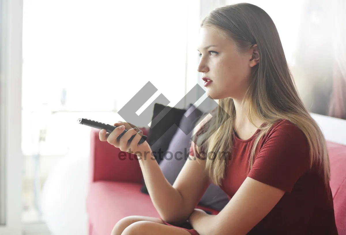 Picture of Smiling businesswoman working on laptop at home office