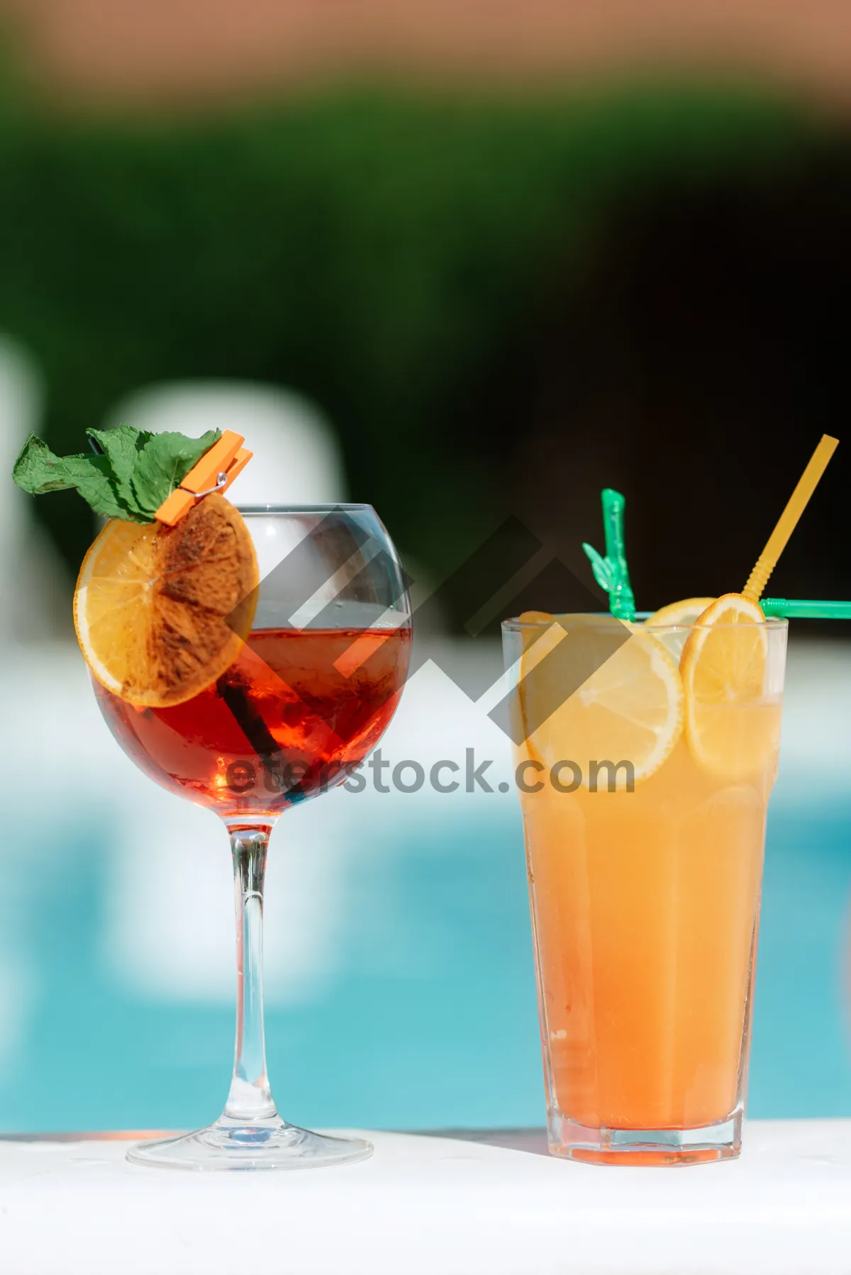 Picture of Refreshing Orange Citrus Cocktail with Ice and Straw