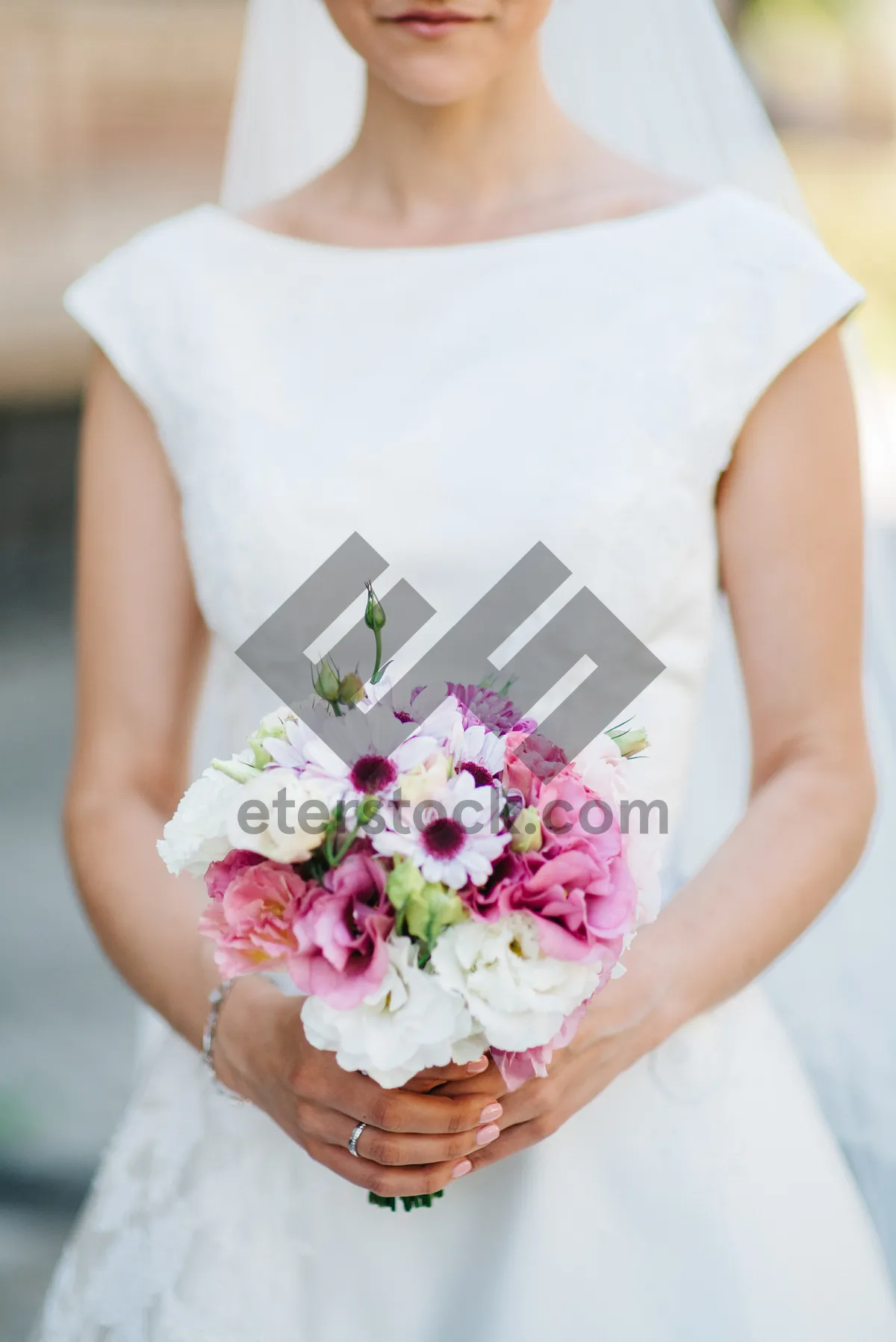 Picture of Happy bride in wedding dress holding bouquet