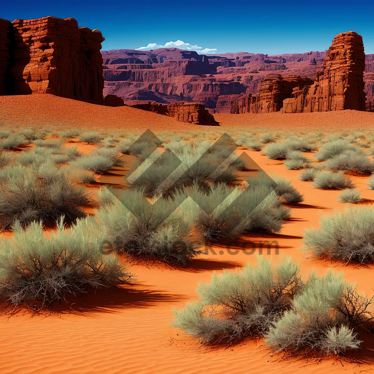 Picture of Majestic Desert Landscape with Vibrant Orange Sky