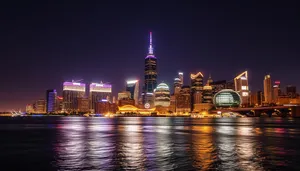 City skyline with illuminated modern office buildings at night