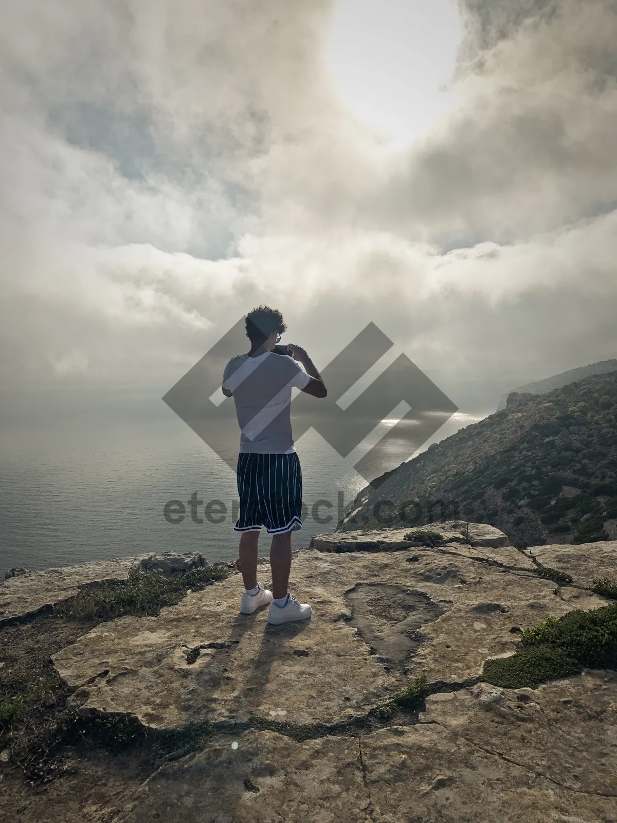 Picture of Mountain trail runner in summer landscape.