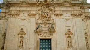 Historic Cathedral Facade with Ancient Columns and Stucco