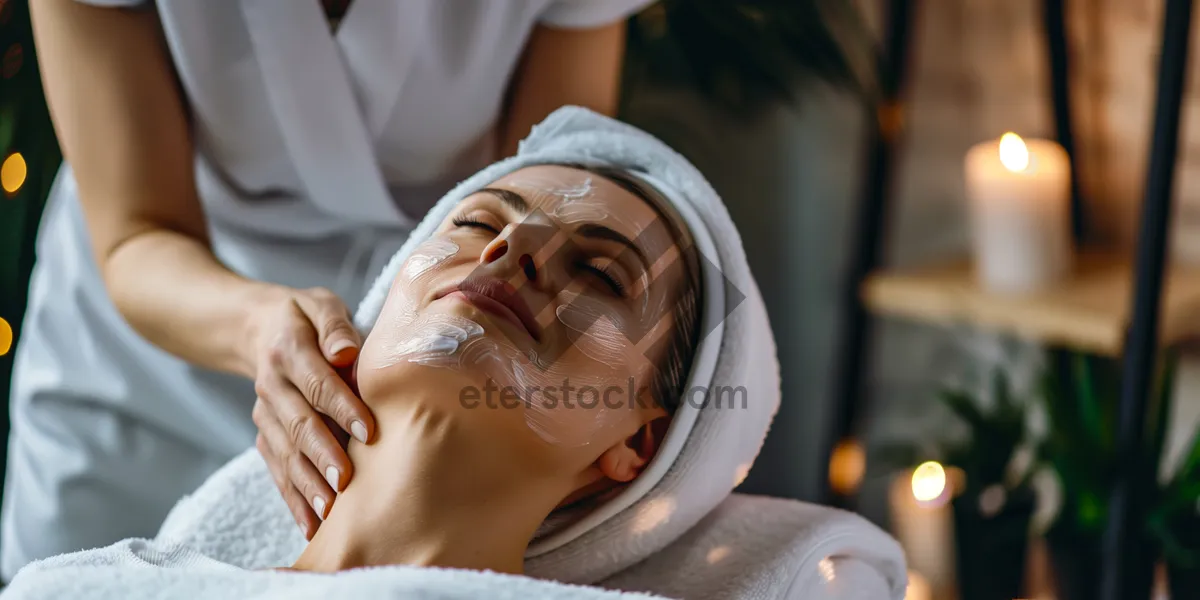 Picture of Attractive woman smiling during spa massage treatment