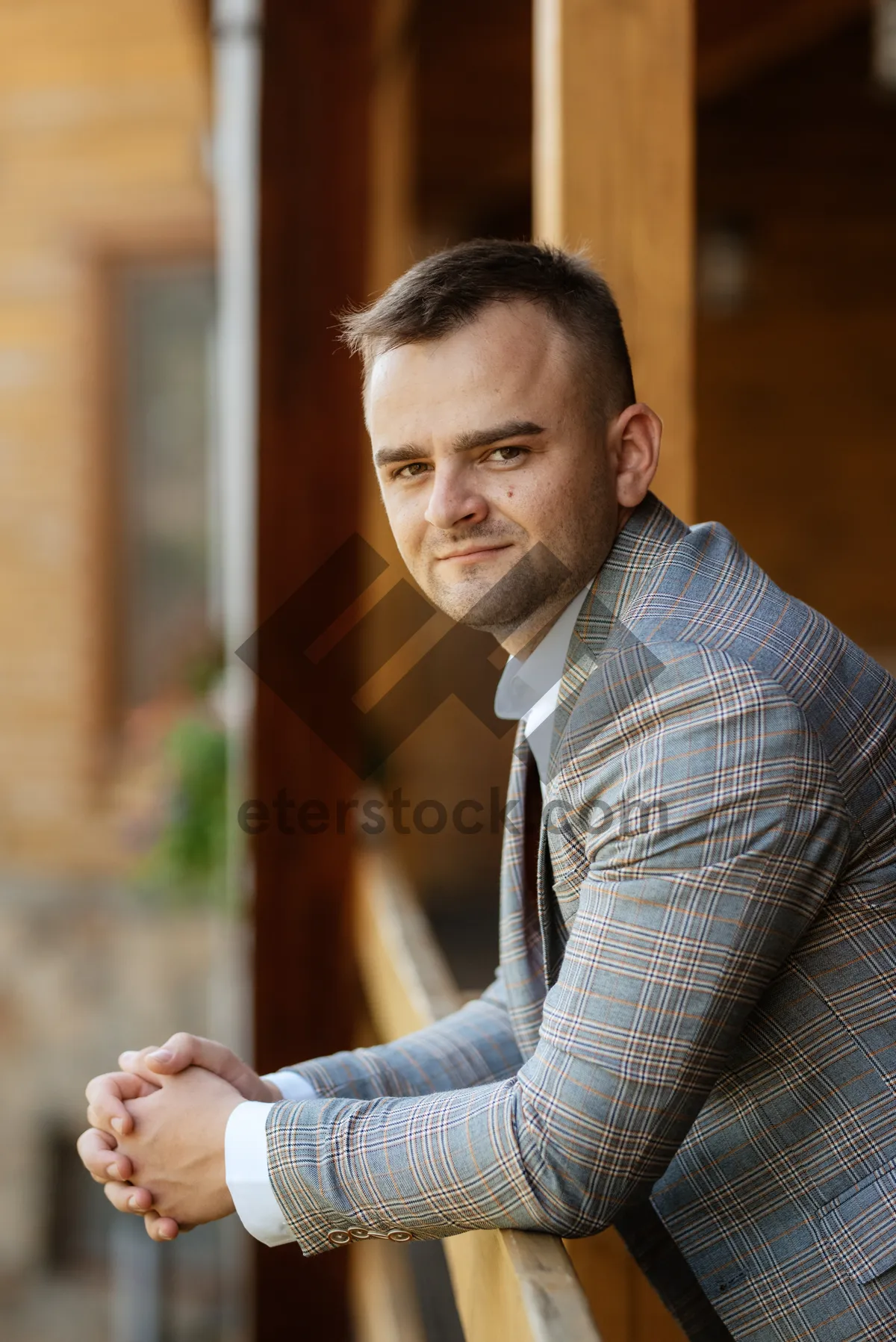 Picture of Confident young man smiling in office