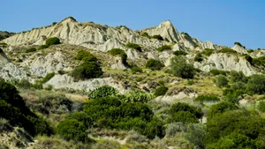 Scenic mountain landscape view with cloudy sky and trees