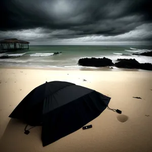 Beach Bliss: Tranquil Ocean Sunset with Umbrella