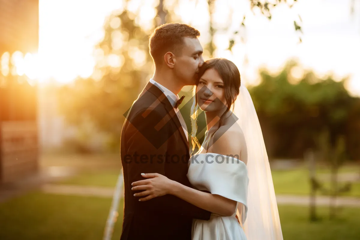 Picture of Happy newlywed couple smiling in the park portrait.