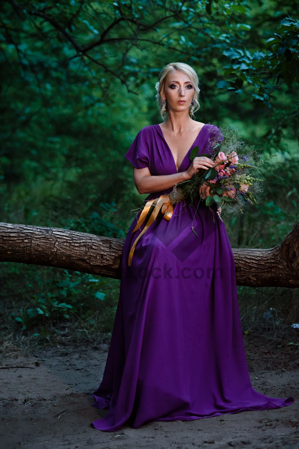 Picture of Fashionable bride in elegant wedding dress smiling happily.