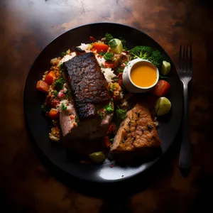 Gourmet black pepper steak with grilled vegetables dish.