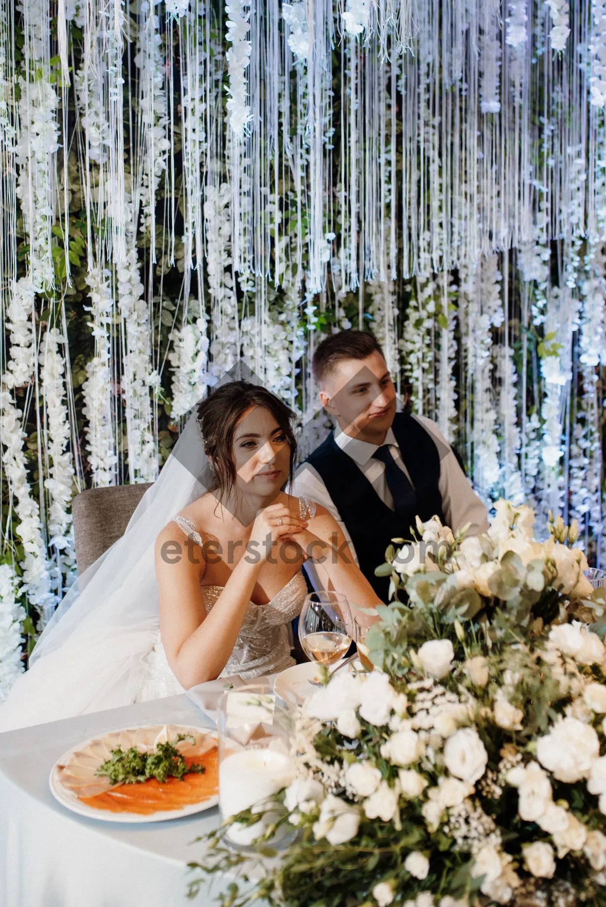 Picture of Happy bride and groom smiling on wedding day.