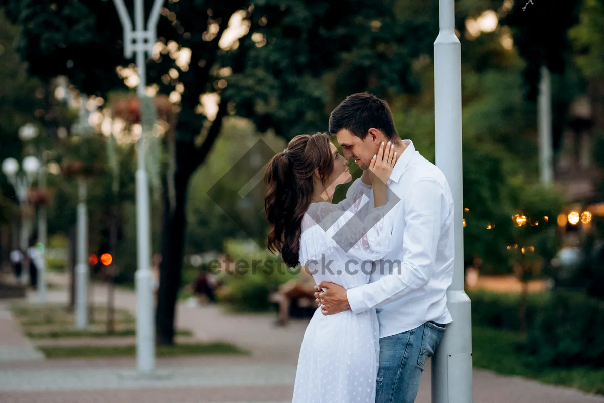 Picture of Happy Couple Smiling Together in Park at Sunset