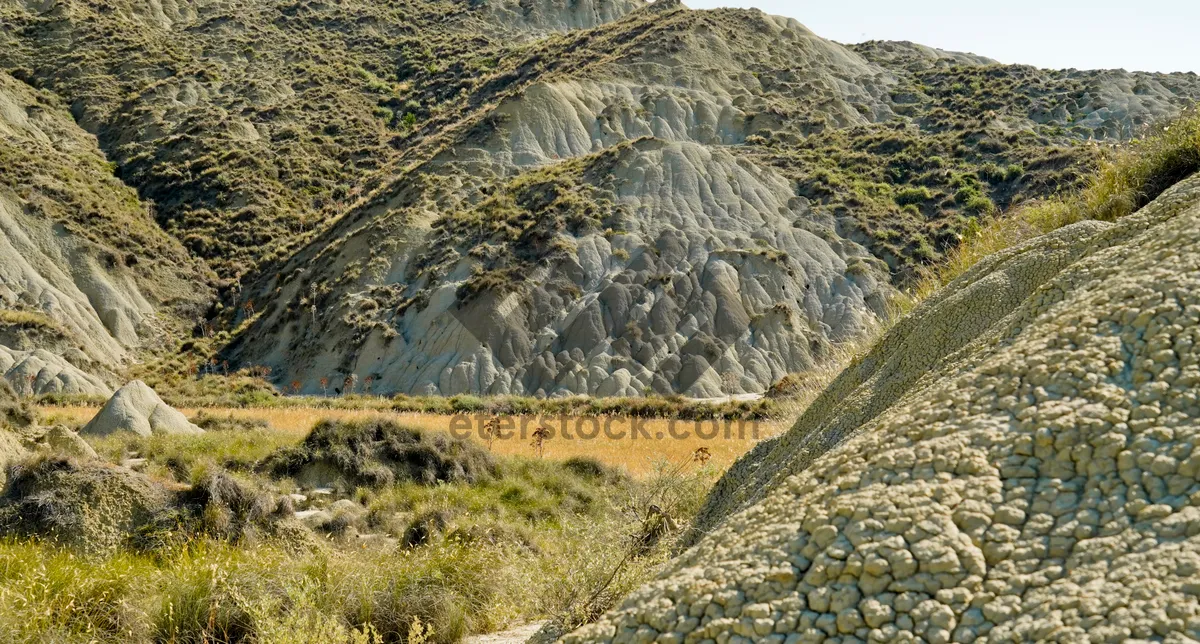 Picture of Mountain Range Covered in Clouds