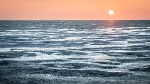 Tropical Sunset Reflection on Tranquil Beach