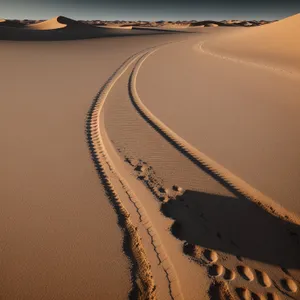 Sandy Desert Dunes Against Clear Blue Sky