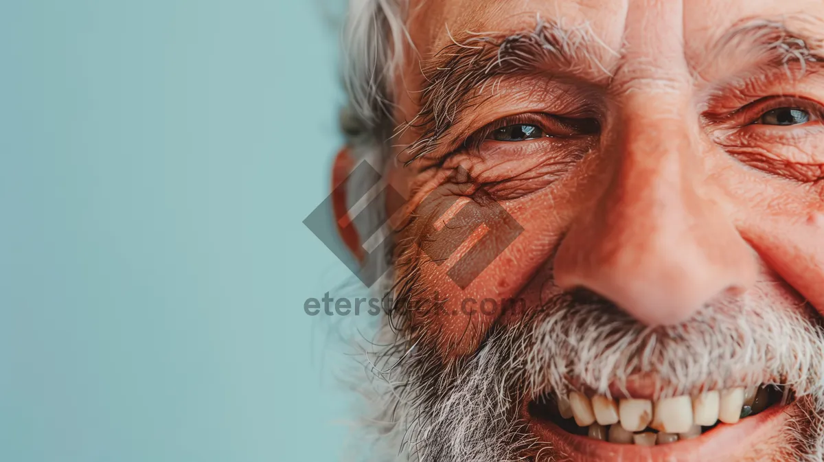 Picture of Happy elderly man with beard and mustache smiling portrait.