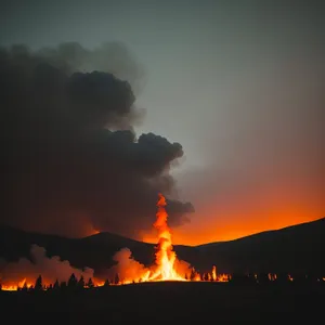 Blazing Volcanic Sunset: Fiery Mountain Illuminated by Orange Flames
