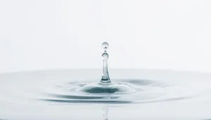 Clear Water Splash in Motion with Glass and Drops