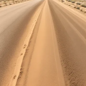 Endless Desert Road, Earthy Dunes Underneath Wide Sky