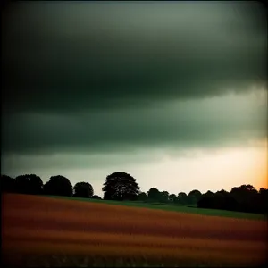 Vibrant Sunset Over Rural Meadow and Fields