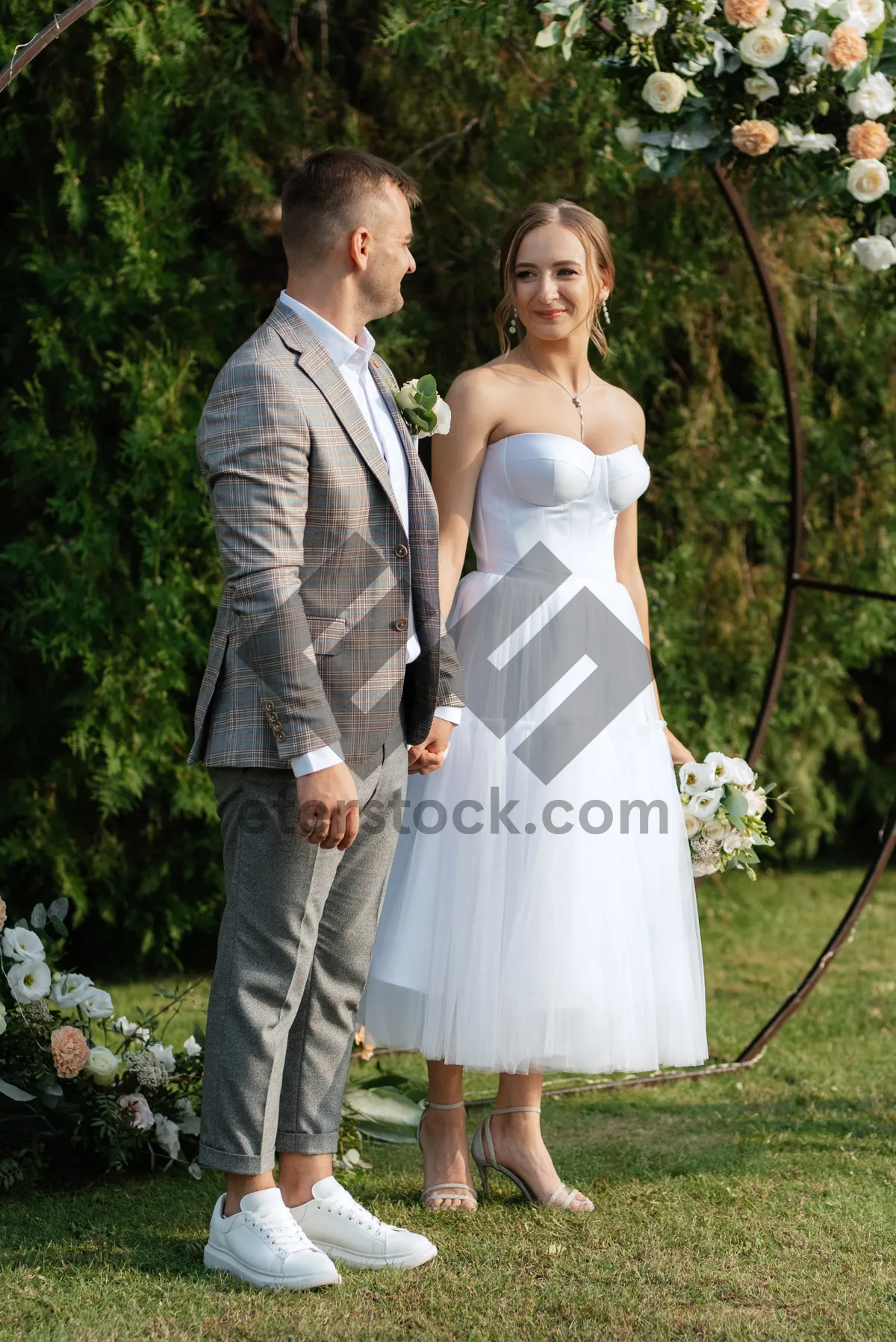 Picture of Happy wedding couple in the park celebrating love.