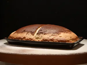 Fresh baked bread and cappuccino for breakfast meal.