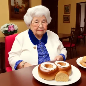 Smiling Senior Couple Enjoying Meal Together