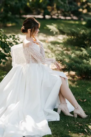 Fashionable Bride Smiling Happily with Bouquet