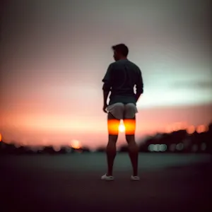 Sunset Runner in Action: Active Athlete Embracing Freedom on Beach