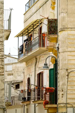 Old city architecture with ancient balcony and windows.