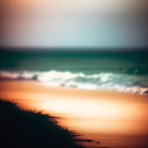 Golden Sunset Over Serene Ocean Beach