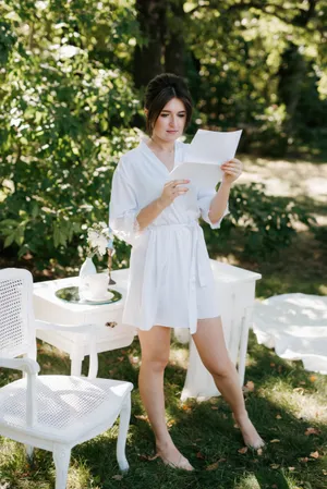 Happy male waiter in outdoor setting smiling