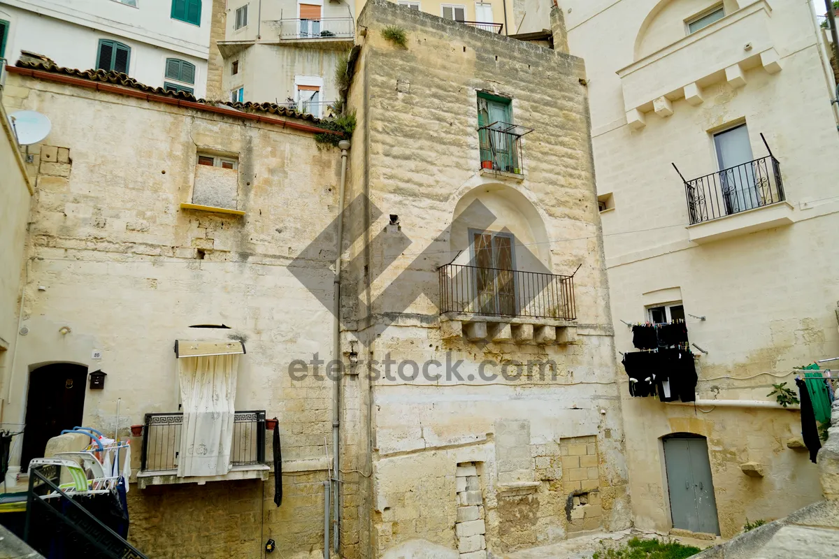 Picture of Historic stone building with balcony in old city center.