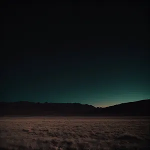 Serenity at Sunset: Majestic Mountain Range and Clouds