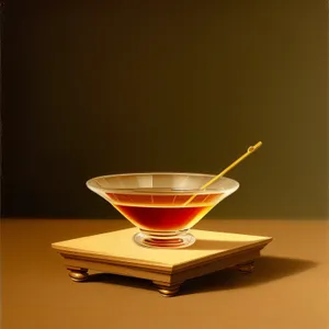 Hot Tea in Glass Mug with Saucer and Spoon