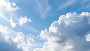 Vibrant summer sky with fluffy clouds and sunlight