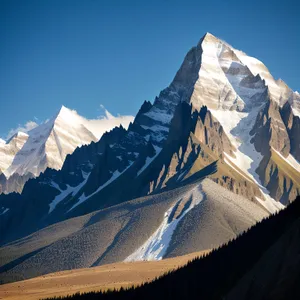 Majestic Winter Wonderland: Snow-Capped Peak in Glacial Landscape