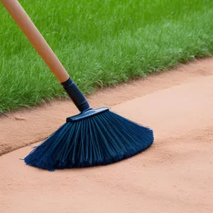 Golfer's Cleanup Crew: Rake, Broom, and Tools