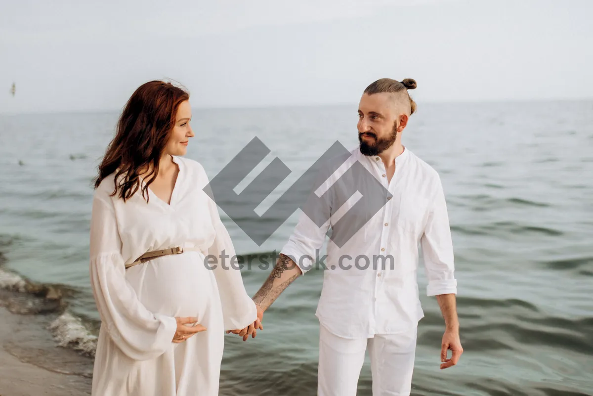 Picture of Happy couple enjoying beach vacation by the sea