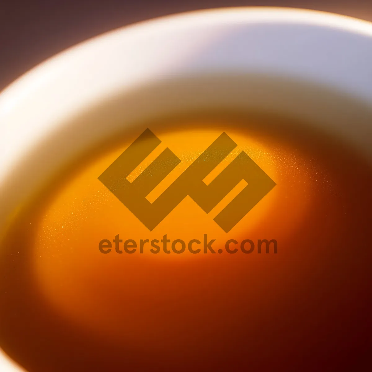 Picture of Hot Herbal Tea in Yellow Saucer with Spoon