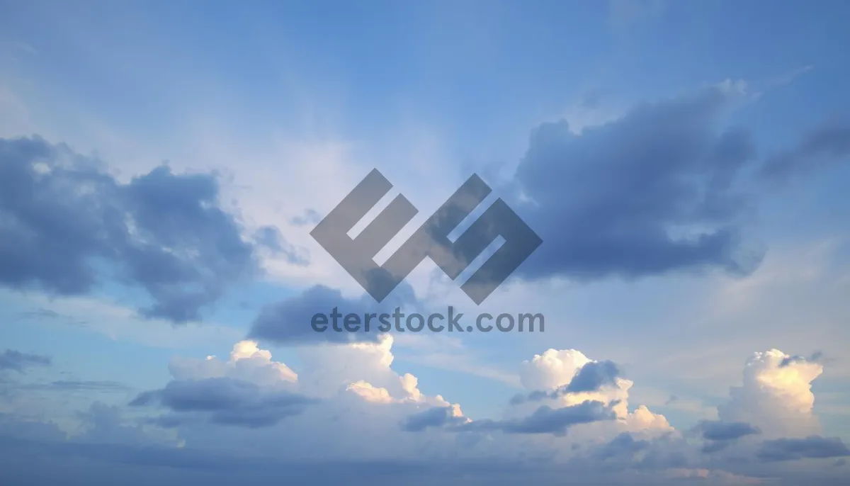 Picture of Soaring sunlit clouds in a clear blue sky