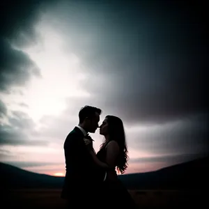 Romantic Silhouette of Happy Newlyweds at Sunset