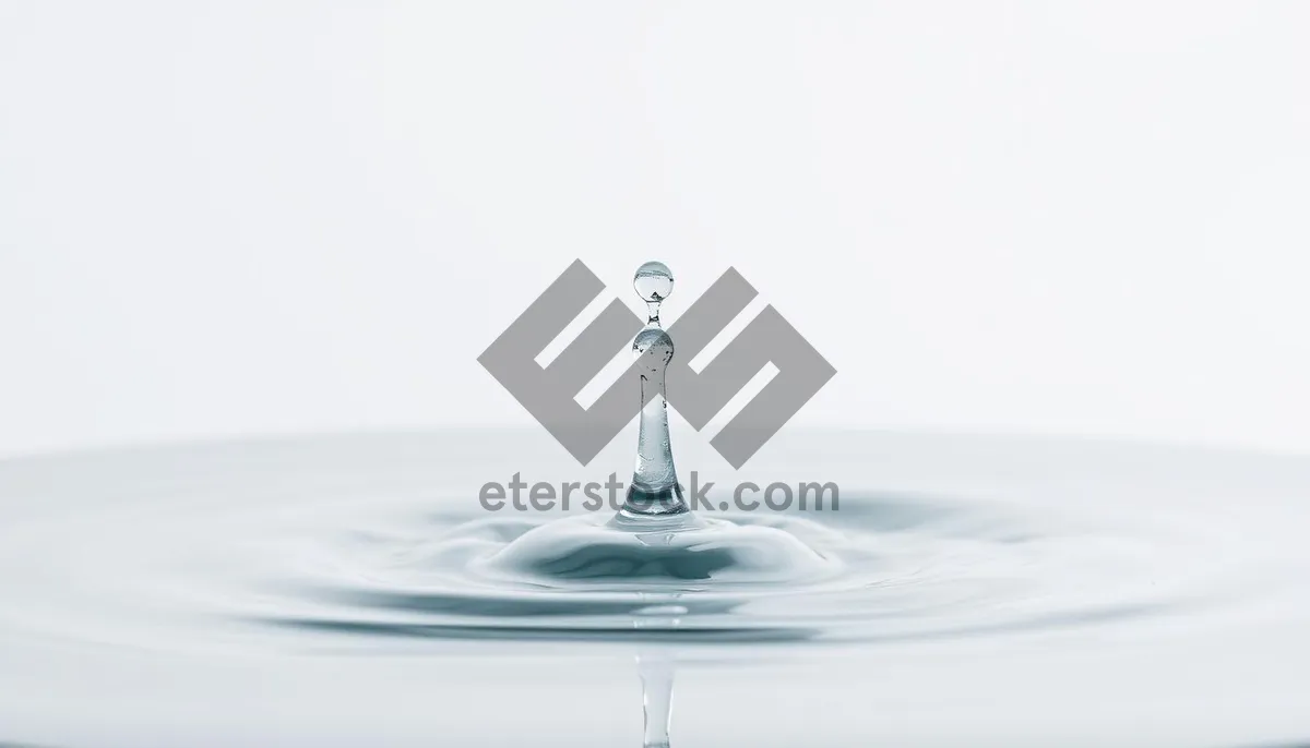 Picture of Clear Water Splash in Motion with Glass and Drops