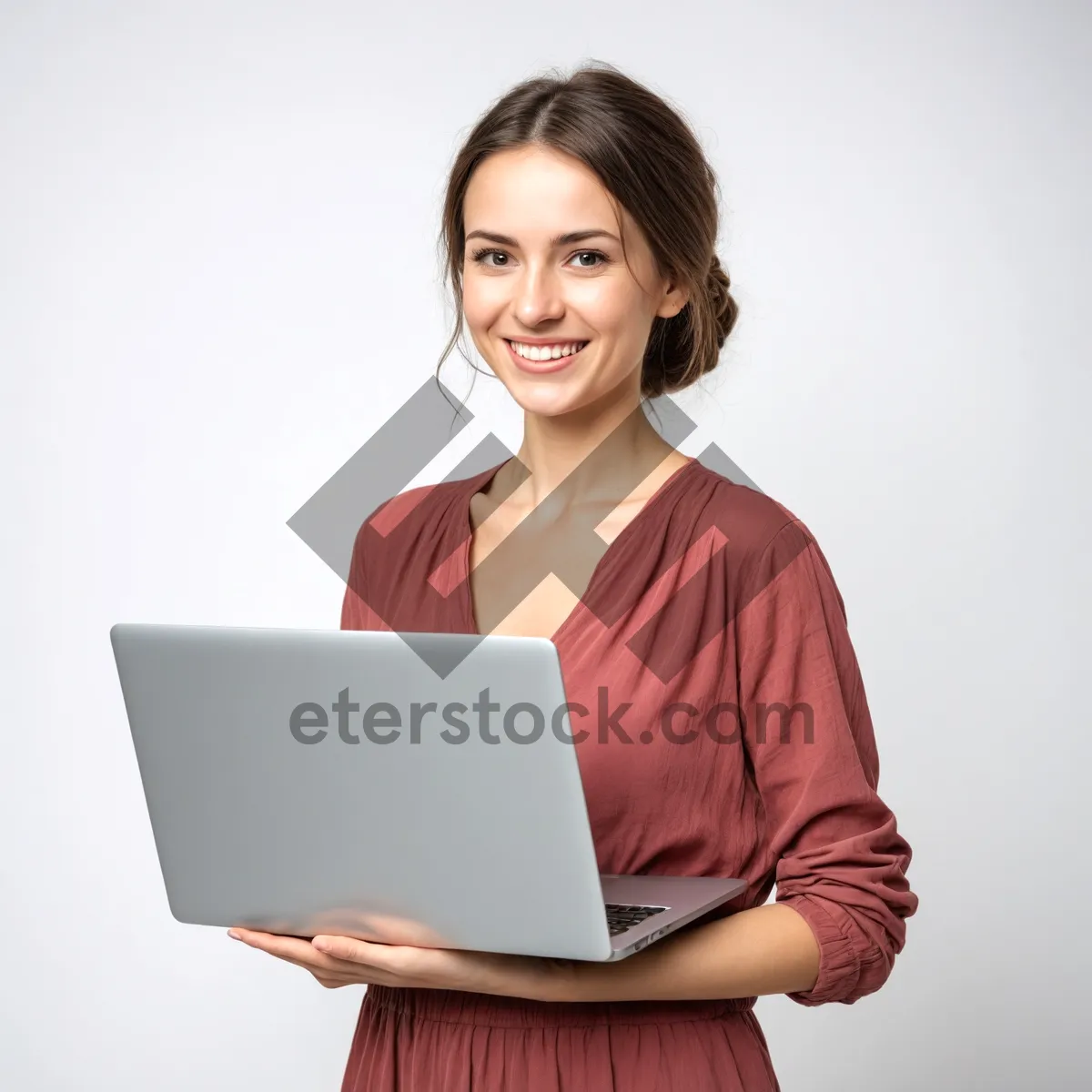 Picture of Smiling businesswoman working on laptop in office