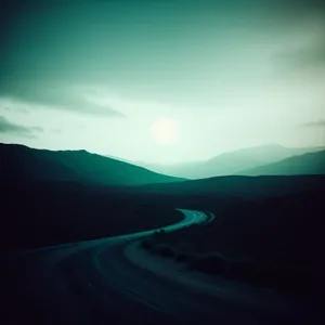 Vibrant Sunset over Serene Desert Landscape