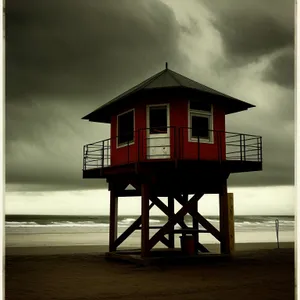 Coastal Beach Boathouse Tower Amidst Serene Waters