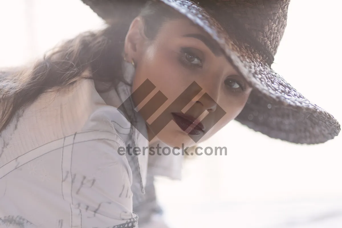 Picture of Pretty blond model in cute hat smiling happily